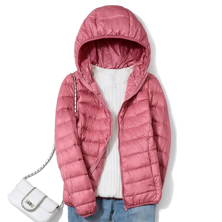 Piumino da donna rosa antico con cappuccio appeso