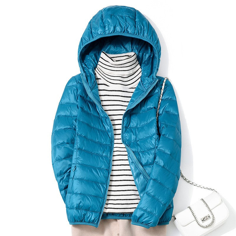 Piumino da donna blu petrolio con cappuccio appeso