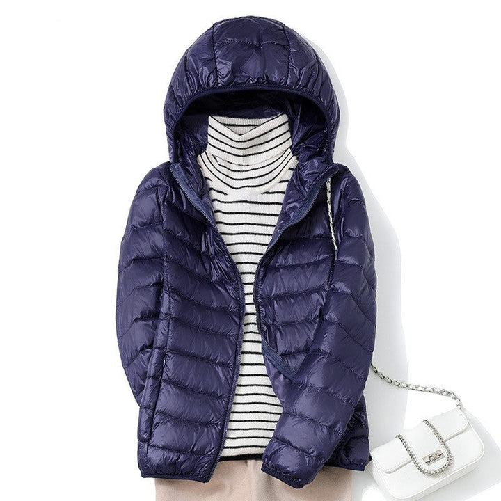 Piumino da donna blu navy con cappuccio appeso