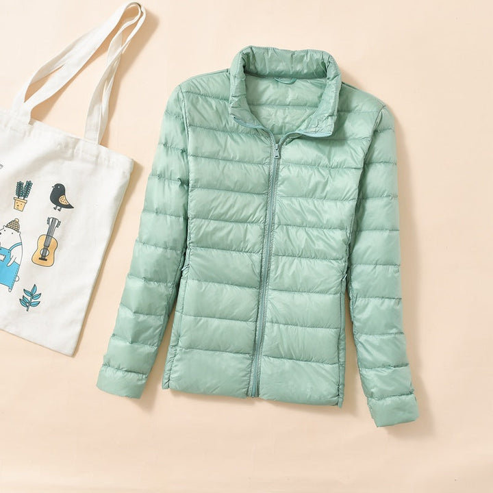 Piumino da donna verde con collo alto – vista frontale